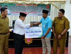 Bupati Agam Serahkan Santunan Kematian dan Perlindungan Sosial Ketenagakerjaan Bagi Pekerja Sawit